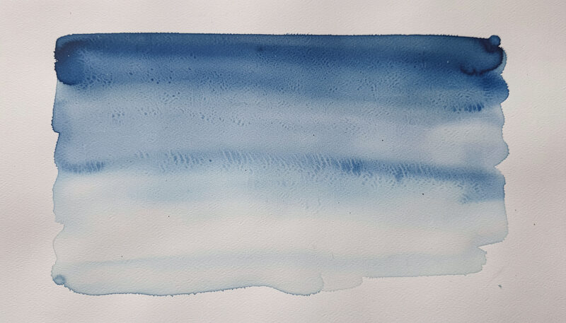 A graded wash of blue sky bleeding into a pale horizon on wet paper, water pooling at the lower edge.